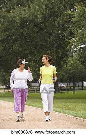 Women walking with hand weights View Large Photo Image Stock Photo - Women walking with hand weights. Fotosearch