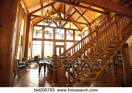 Stock Image - Wooden ceiling and stairs in luxury living room. Fotosearch