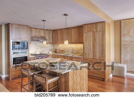 Stock Photo - Wooden cupboards in luxury kitchen. Fotosearch