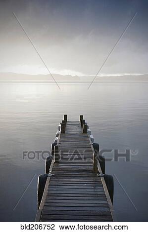 Stock Image - Wooden Jetty Over a Lake. Fotosearch