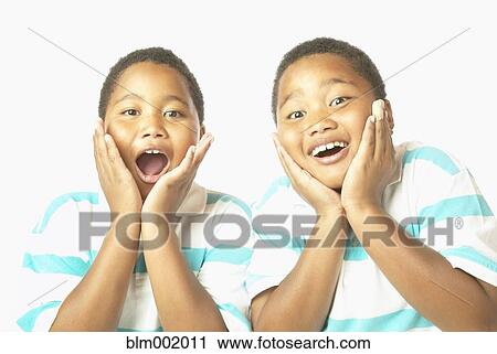 Young African twin brothers looking surprised View Large Photo Image Stock Image - Young African twin brothers looking surprised. Fotosearch