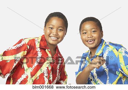 Young African twin brothers smiling View Large Photo Image Stock Photo - Young African twin brothers smiling. Fotosearch