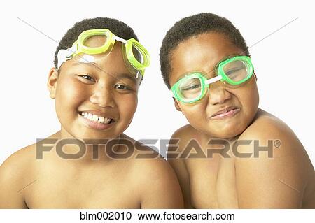Young African twin brothers wearing swimming goggles View Large Photo Image Stock Image - Young African twin brothers wearing swimming goggles. Fotosearch