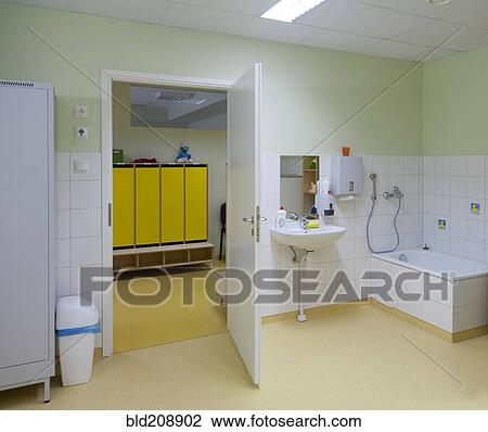 A bathroom, and shower, with hand basin and storage for pots View Large Photo Image Stock Image - A bathroom, and shower, with hand basin and storage for pots. Fotosearch