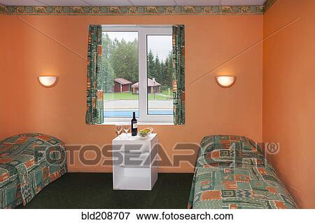 A bedroom with two beds View Large Photo Image Stock Photo - A bedroom with two beds. Fotosearch