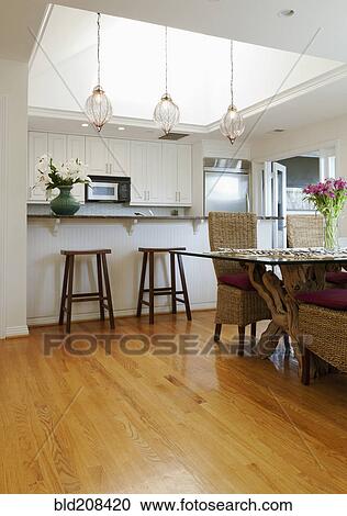 Stock Image - A contemporary kitchen with a breakfast bar. Fotosearch