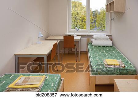 A dormitory bedroom with beds and bed linen View Large Photo Image Stock Photo - A dormitory bedroom with beds and bed linen. Fotosearch