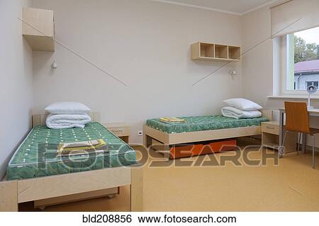 A dormitory bedroom with beds and bed linen View Large Photo Image Stock Photograph - A dormitory bedroom with beds and bed linen. Fotosearch