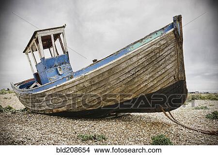 Picture - A fishing boat on the beach at Dungeness. Fotosearch