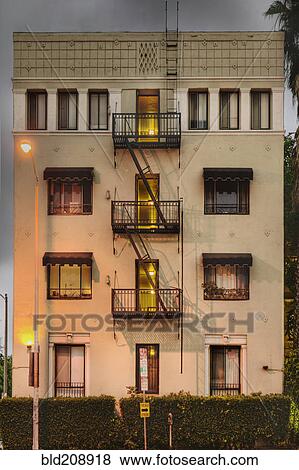A four story apartment building on Sunset Boulevard View Large Photo Image Stock Photo - A four story apartment building on Sunset Boulevard. Fotosearch