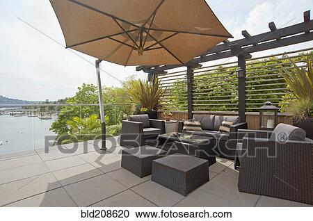 A house terrace overlooking the water View Large Photo Image Stock Image - A house terrace overlooking the water. Fotosearch