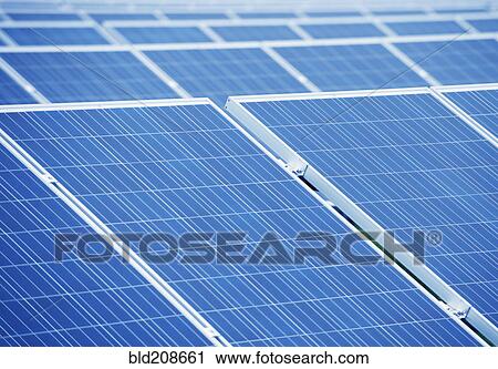 A large group of solar panels, tilted at an angle View Large Photo Image Stock Image - A large group of solar panels, tilted at an angle. Fotosearch