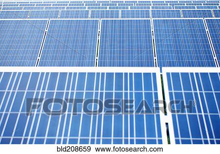 A large group of solar panels, tilted at an angle View Large Photo Image Stock Photo - A large group of solar panels, tilted at an angle. Fotosearch