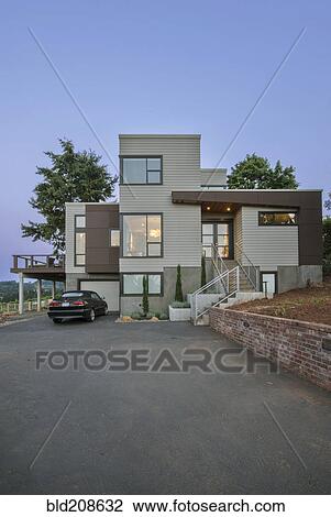 Stock Image - A modern house in Oregon at dusk. Fotosearch