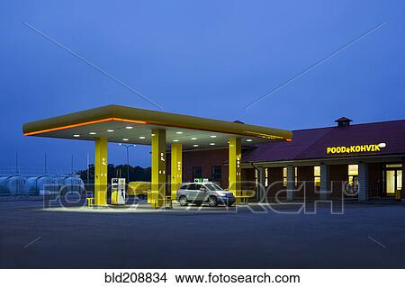 Picture - A roadside garage at night. Fotosearch
