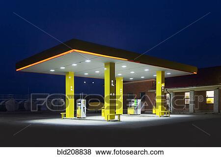A roadside garage at night View Large Photo Image Stock Photo - A roadside garage at night. Fotosearch