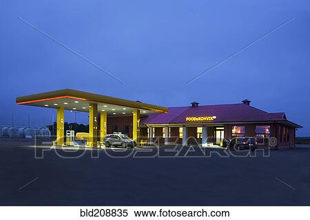 Stock Photography - A roadside garage at night. Fotosearch