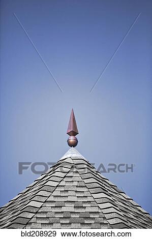 A shingle roof, with small grey times, and a central pinnacle View Large Photo Image Stock Photo - A shingle roof, with small grey times, and a central pinnacle. Fotosearch
