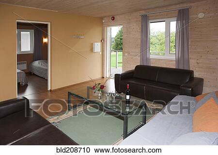 Stock Image - A sitting room in a suite, with sofas and table. Fotosearch