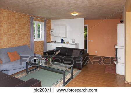 Stock Image - A sitting room in a suite, with sofas and table. Fotosearch