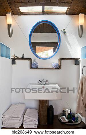 A small bathroom interior, with basin and mirror View Large Photo Image Stock Photo - A small bathroom interior, with basin and mirror. Fotosearch