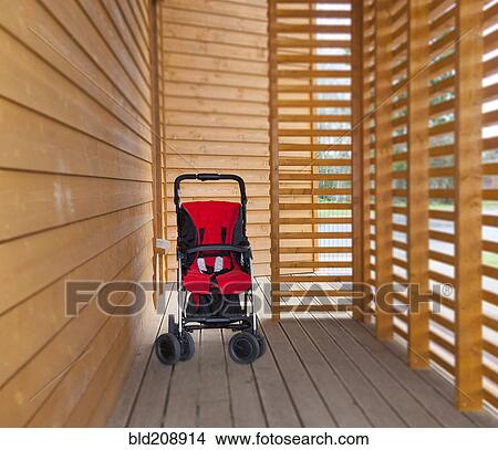 A small red child's buggy with a red seat View Large Photo Image Picture - A small red child's buggy with a red seat. Fotosearch