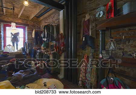 A small trendy clothes store View Large Photo Image Stock Image - A small trendy clothes store. Fotosearch