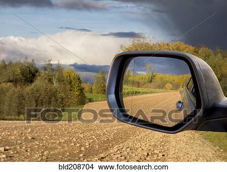 A view of the road behind a vehicle in a car's side mirror View Large Photo Image Picture - A view of the road behind a vehicle in a car's side mirror. Fotosearch