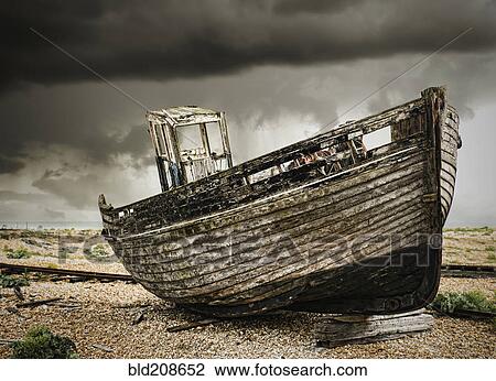 A wooden fishing boat, on the beach at Dungeness View Large Photo Image Stock Image - A wooden fishing boat, on the beach at Dungeness. Fotosearch