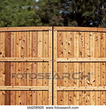 Stock Photograph - A wooden garden fence. Fotosearch