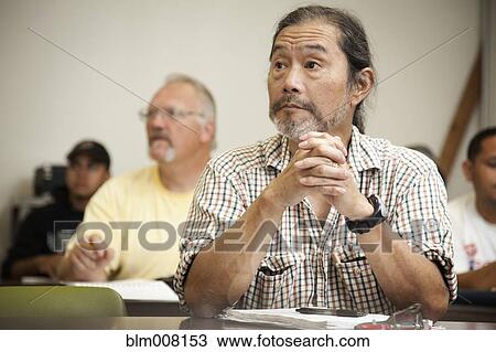 Adult students listening in classroom View Large Photo Image Stock Image - Adult students listening in classroom. Fotosearch