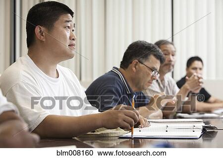Adult students listening in classroom View Large Photo Image Stock Image - Adult students listening in classroom. Fotosearch