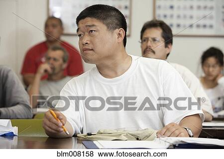 Adult students listening in classroom View Large Photo Image Stock Photo - Adult students listening in classroom. Fotosearch