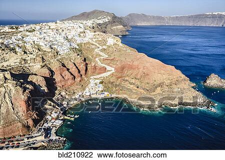 Aerial view of city built on rocky coastline, Oia, Egeo, Greece View Large Photo Image Stock Image - Aerial view of city built on rocky coastline, Oia, Egeo, Greece. Fotosearch