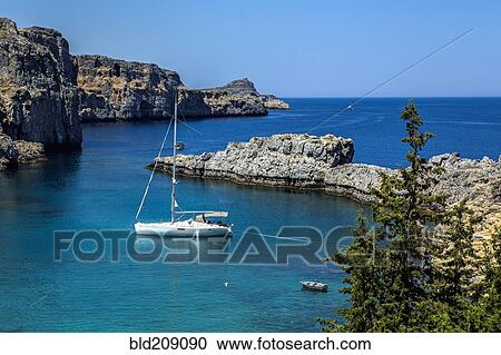 Aerial view of sailboat in St. Paul's bay, Santorini, Greece View Large Photo Image Stock Image - Aerial view of sailboat in St. Paul's bay, Santorini, Greece. Fotosearch