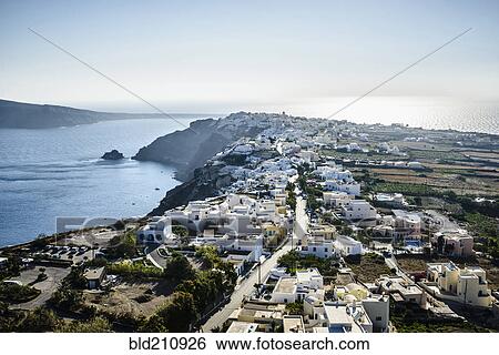 Stock Photograph - Aerial view of town along ocean, Oia, Egeo, Greece. Fotosearch