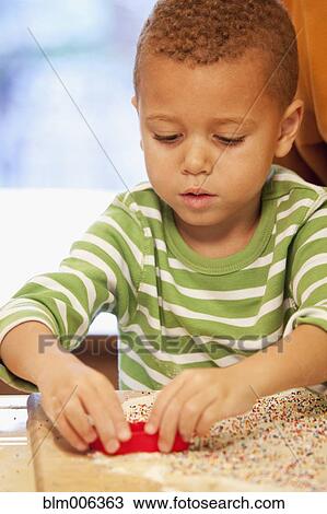 African American boy making cookies View Large Photo Image Stock Image - African American boy making cookies. Fotosearch