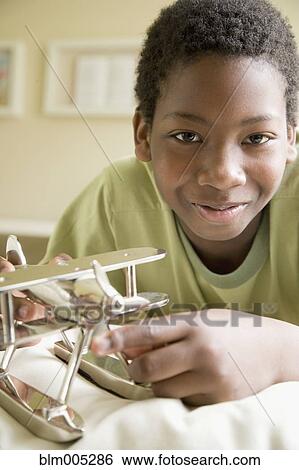 African American boy with model airplane View Large Photo Image Stock Photograph - African American boy with model airplane. Fotosearch