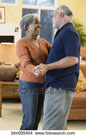 African American couple dancing in living room View Large Photo Image Picture - African American couple dancing in living room. Fotosearch