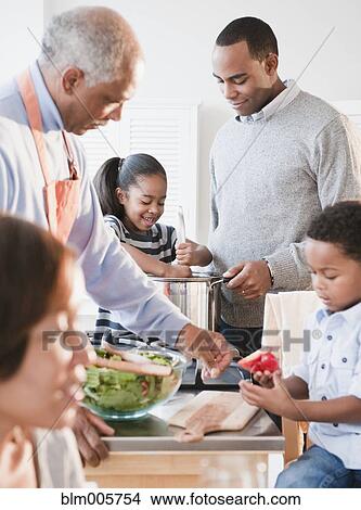 African American family cooking together View Large Photo Image Picture - African American family cooking together. Fotosearch