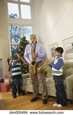 African American family playing musical instruments together View Large Photo Image Picture - African American family playing musical instruments together. Fotosearch