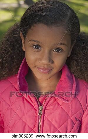 Stock Photo - African American girl smiling . Fotosearch