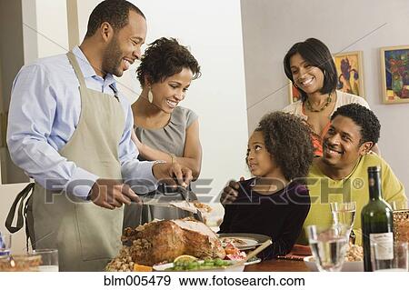 African American man carving Thanksgiving turkey View Large Photo Image Stock Photo - African American man carving Thanksgiving turkey. Fotosearch