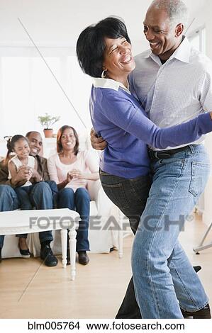 African American man dancing with wife in living room View Large Photo Image Picture - African American man dancing with wife in living room. Fotosearch