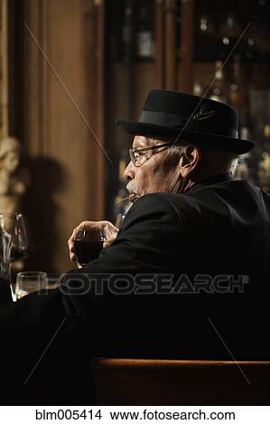 African American man drinking in bar View Large Photo Image Picture - African American man drinking in bar. Fotosearch