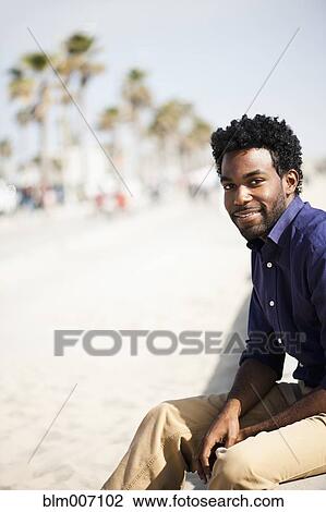 African American man sitting outdoors View Large Photo Image Stock Image - African American man sitting outdoors. Fotosearch
