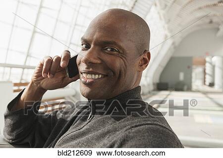 African American man talking on cell phone View Large Photo Image Stock Photo - African American man talking on cell phone. Fotosearch