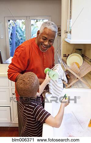 African American man washing dishes with grandson View Large Photo Image Stock Image - African American man washing dishes with grandson. Fotosearch