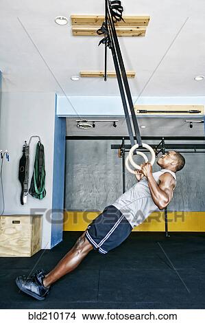 African American man working out in gym View Large Photo Image Picture - African American man working out in gym. Fotosearch