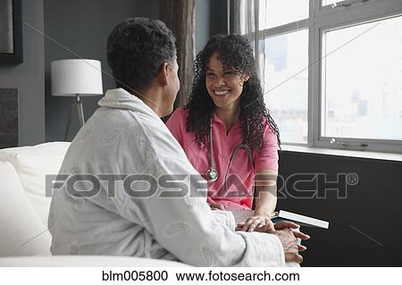 African American nurse checking on patient View Large Photo Image Stock Image - African American nurse checking on patient. Fotosearch
